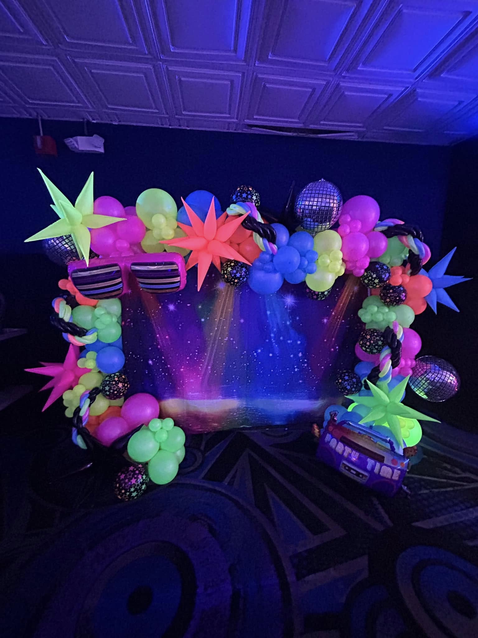 Neon balloons, a sparkling disco backdrop, and all the throwback vibes turned up.