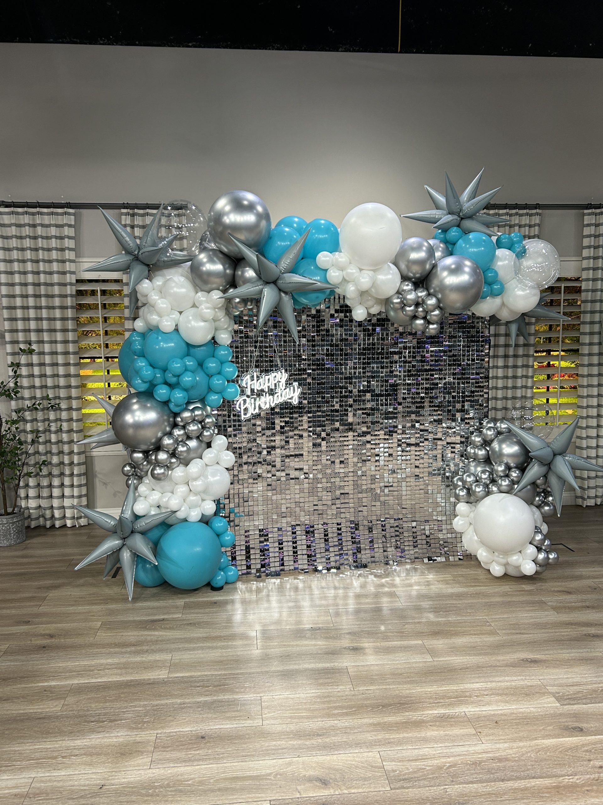 A shimmer wall designed for the ABC4 Good Things Utah birthday show, catching the studio lights beautifully for an elevated, boutique on‑camera moment.