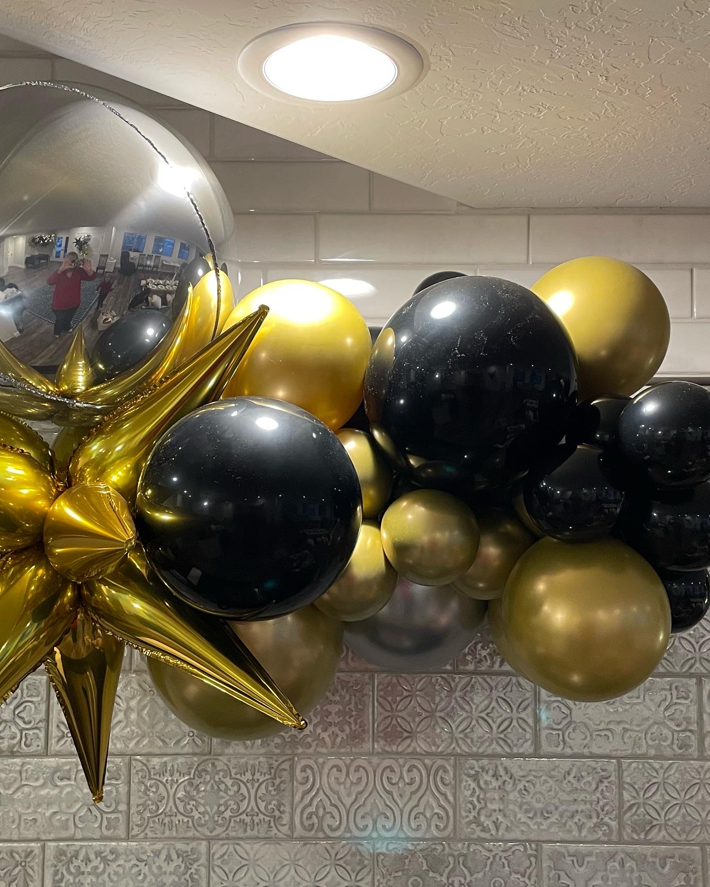 Chic black‑and‑gold garland — a compact, elegant accent for any event.