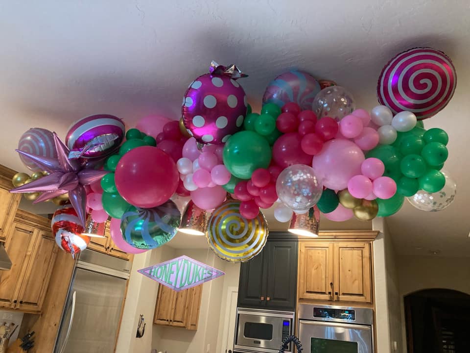 Bright, candy‑themed ceiling installation inspired by Harry Potter — colorful, immersive, and magical.