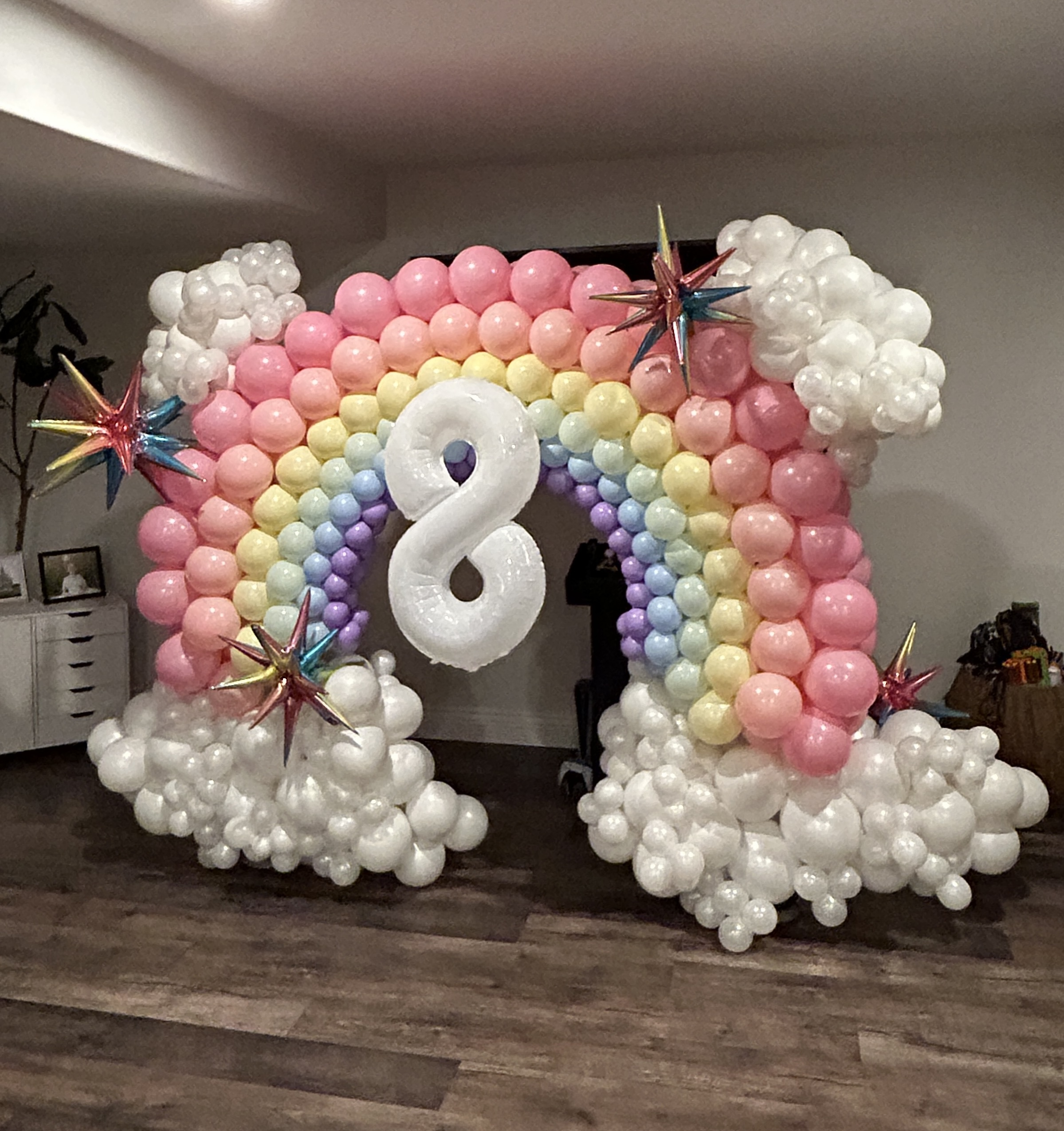 A bright, whimsical rainbow with soft cloud details — a playful, photo‑ready centerpiece that always steals the show.